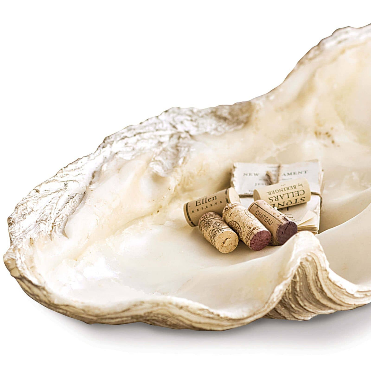Large, off-white resin Imperial Clam replica bowl with textured details, holding wine corks and paper.
