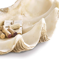 Large, off-white resin clam replica serving as a decorative bowl, showcasing detailed, naturalistic textures.