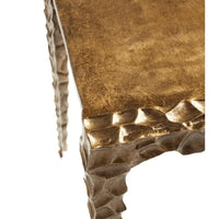 Antique brass aluminum accent table with textured, indented edges and legs.