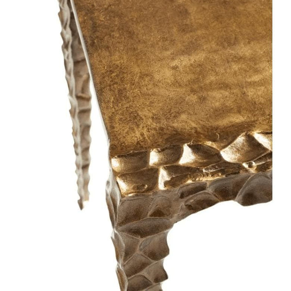Antique brass aluminum accent table with textured, indented edges and legs.