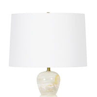 Indie Jade Table Lamp with a unique solid jade base, white linen shade, and polished brass accents.