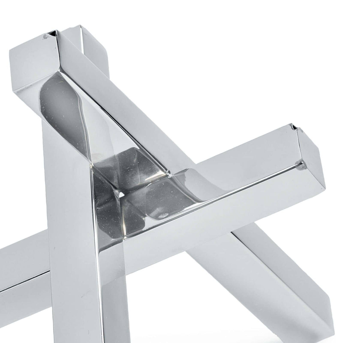 Polished nickel intersecting sculpture with an industrial vibe, featuring reflective surfaces.