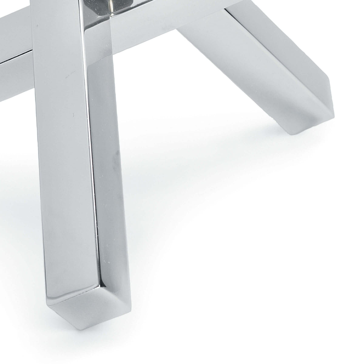 Polished nickel intersecting sculpture with an elegant, industrial design.