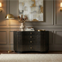 Irene curved black dresser with handcarved vertical fluting, gold pinstripes, and brass pulls.