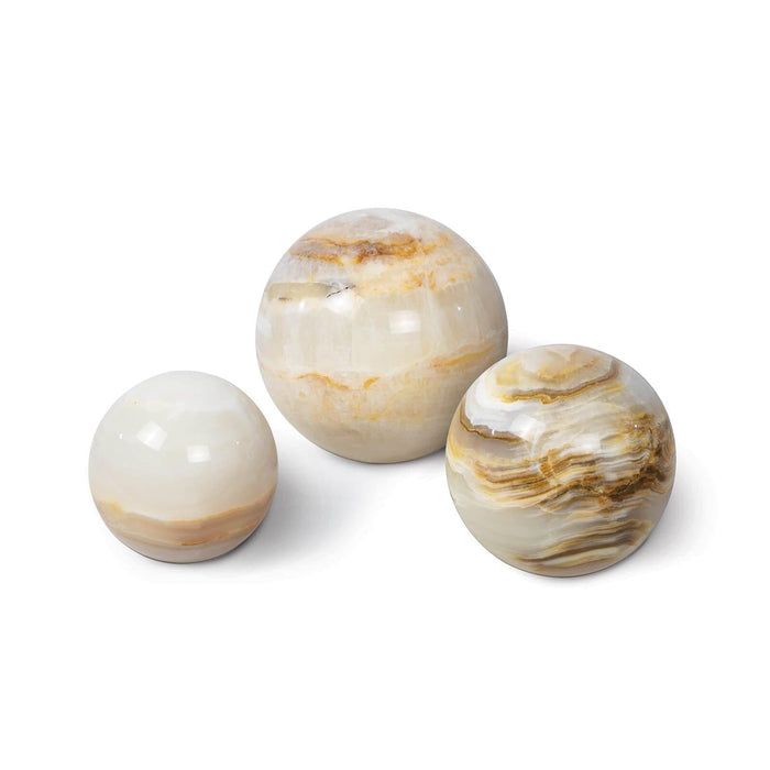 Set of three polished natural jade spheres in varying sizes, featuring white, cream, and brown marbling.