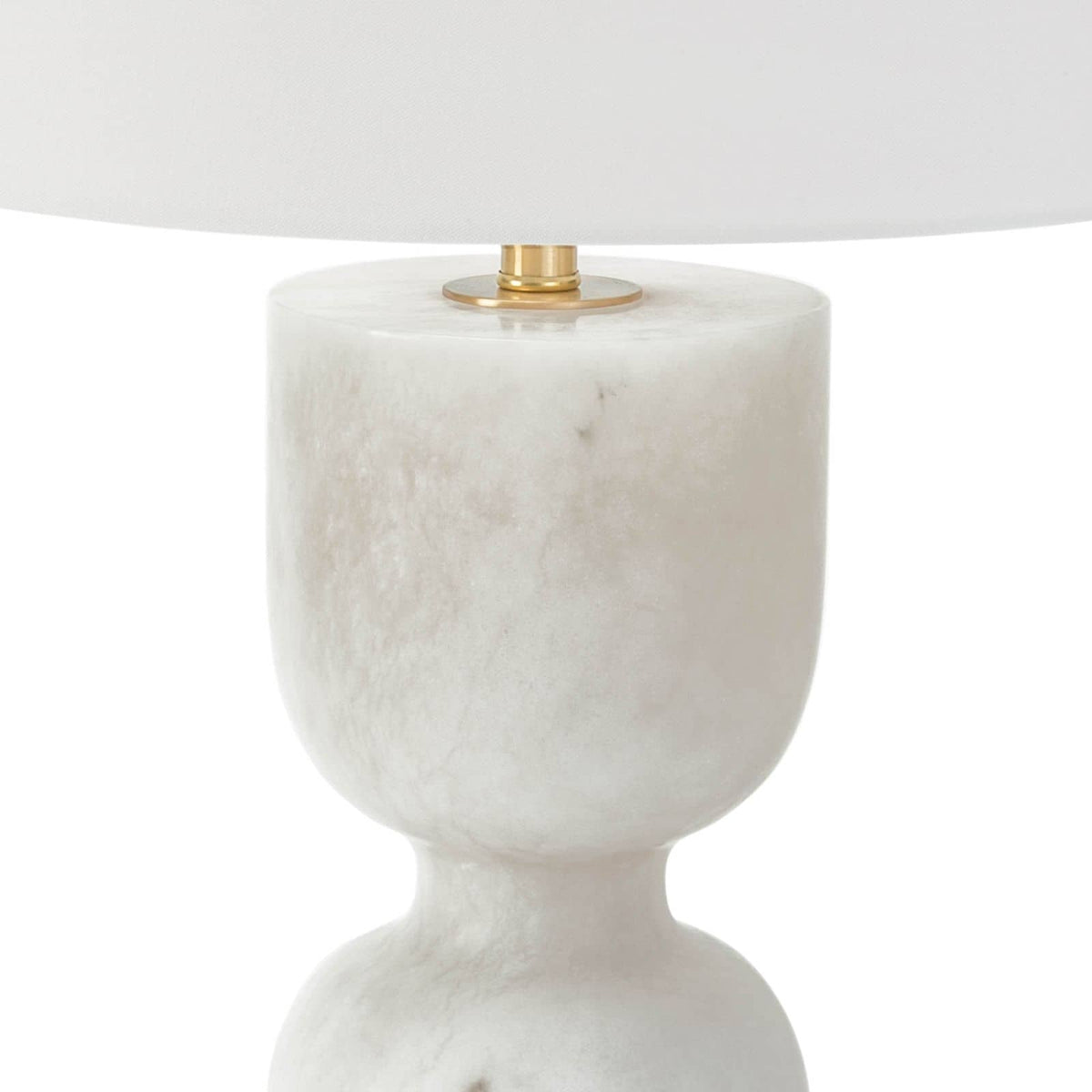 Shapely Joan alabaster table lamp with a white linen shade and polished brass accents.