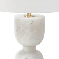 Shapely Joan alabaster table lamp with a white linen shade and polished brass accents.