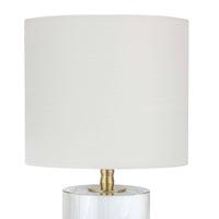 Small Juliet crystal table lamp with natural brass hardware and a white linen drum shade.