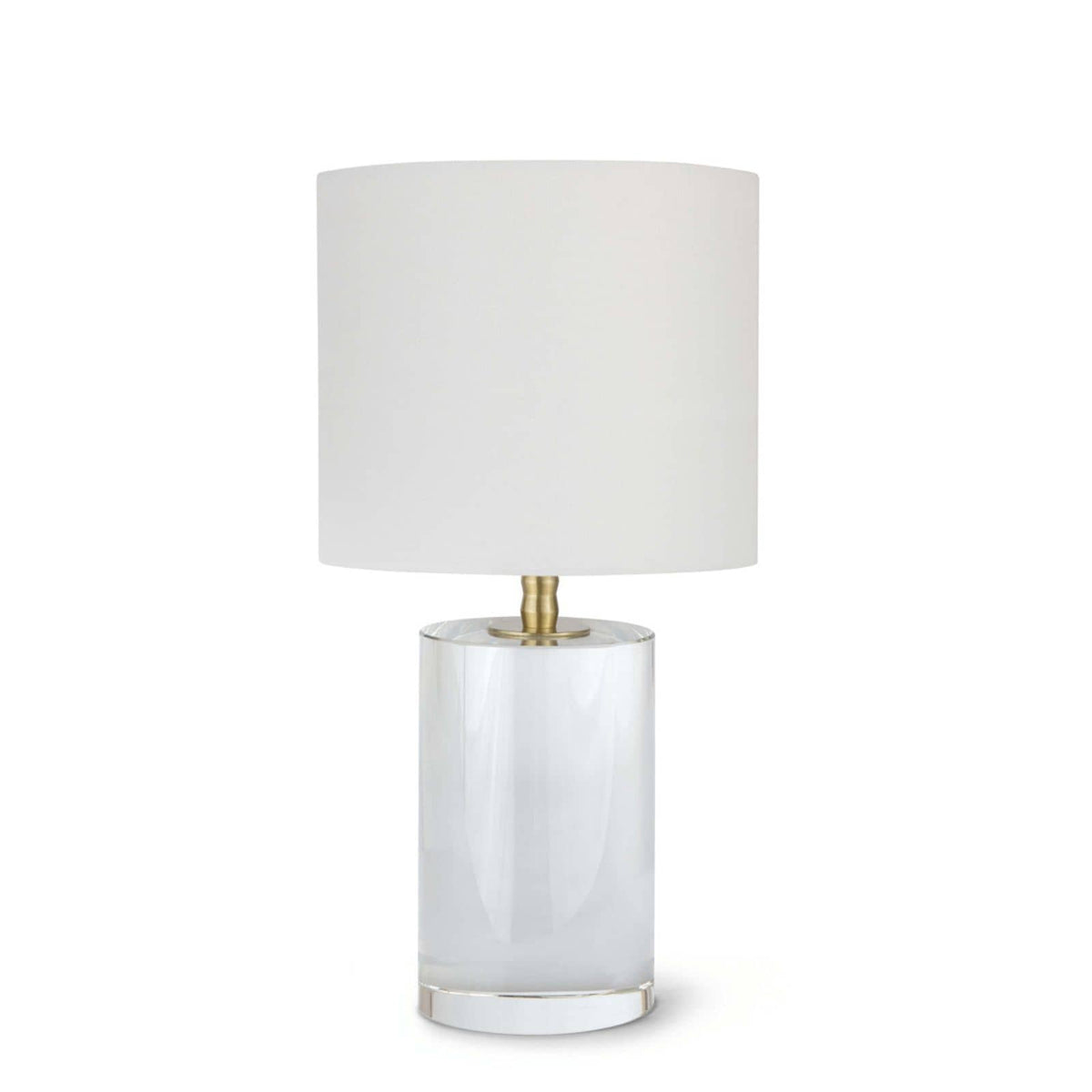 Small Juliet crystal table lamp with a clear cylindrical base, natural brass hardware, and a white linen drum shade.
