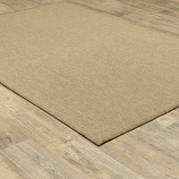 Karavia Sand outdoor rug, a rectangular, power-loomed polypropylene rug with a natural seagrass look on wood flooring.