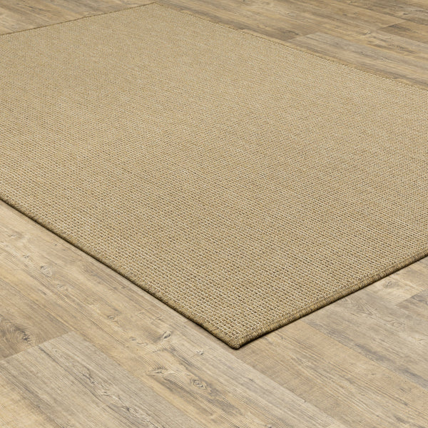 Karavia Sand outdoor rug, a rectangular, power-loomed polypropylene rug with a natural seagrass look on wood flooring.