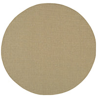 Round Karavia Sand outdoor rug, machine-woven polypropylene with a natural seagrass look.