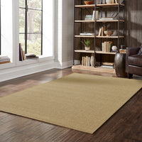 Karavia Tan Outdoor Rug, a durable polypropylene power-loomed rug with a natural seagrass look on a wood floor.