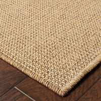 Close-up of a Karavia Tan Outdoor Rug, featuring a durable, machine-woven polypropylene design with a seagrass look.