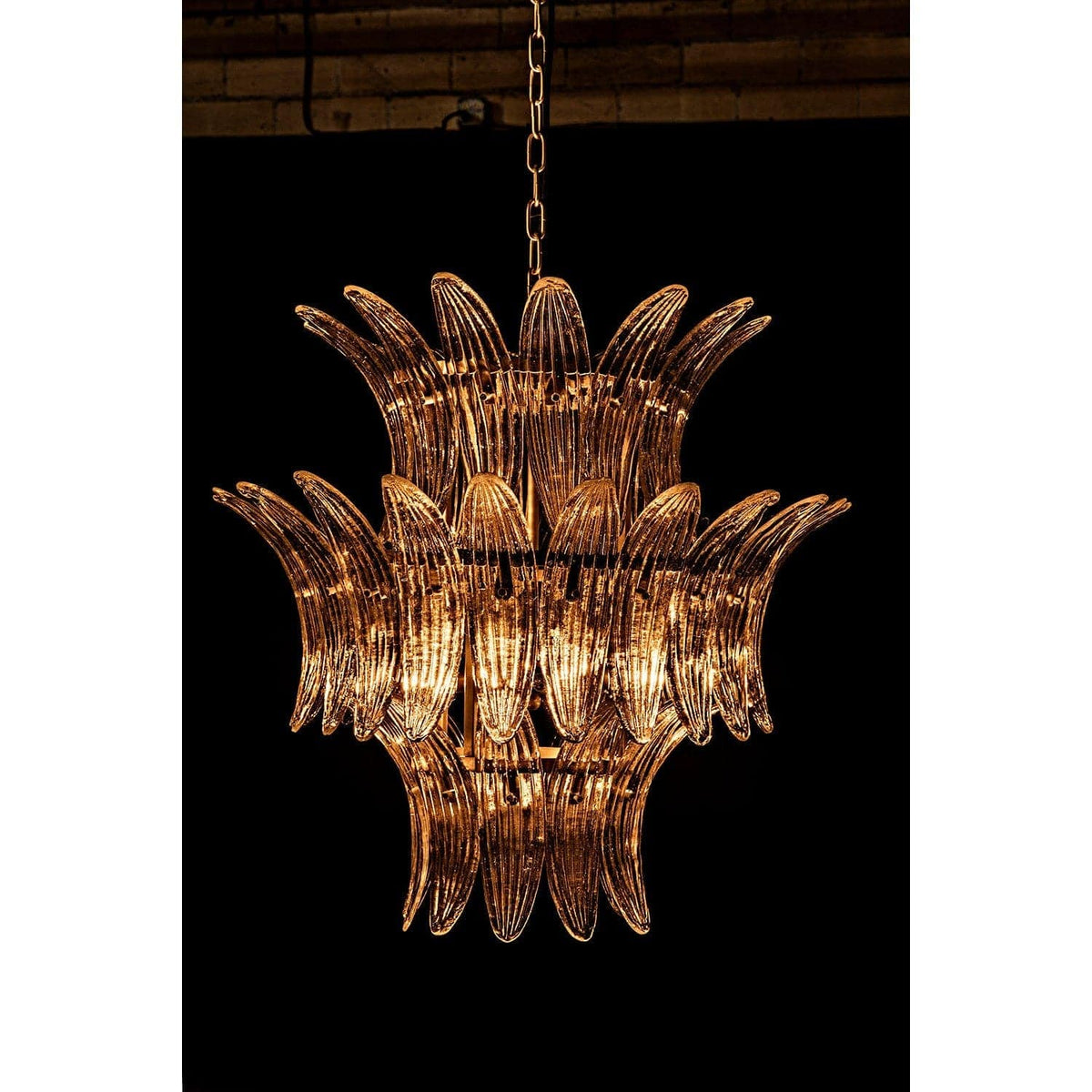 King 3-tier crystal chandelier with burnished brass frame and curved glass crystals.