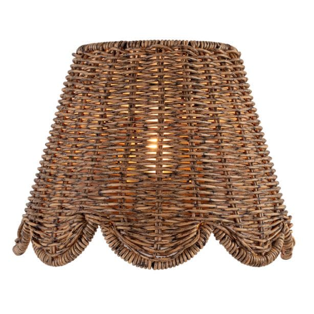 Kismet Sconce with a woven rattan-like shade and a scalloped bottom edge, emitting a warm glow.