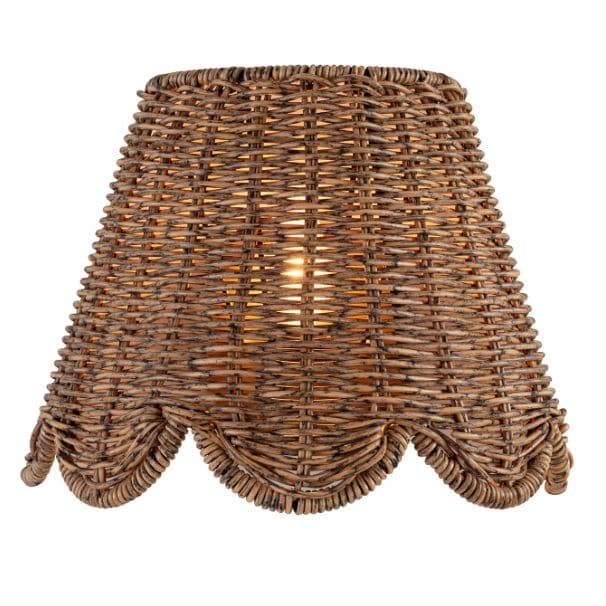Kismet Sconce with a woven rattan-like shade, scalloped bottom edge, and warm glow.