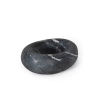 Dark gray marble bowl with white veining, an organic oval shape, and a smooth finish.
