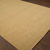Lanai Beige outdoor rug with natural Sisal-inspired multiple weaves on dark wood flooring.