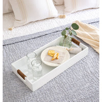 White Logia rectangle tray with rope-wrapped handles, holding glasses and snacks on a bed.