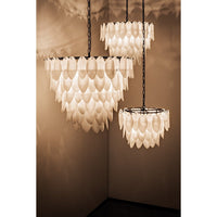 Three tiered Lotus Petal Chandeliers with milk glass petals and antique brass finish.