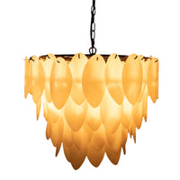 Black/brass lotus petal chandelier with three tiers of glowing milk glass petals.