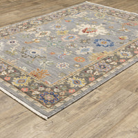 Lucca Blue & Multi Traditional Rug: cross-woven wool/nylon, gray base with vibrant floral patterns and border.