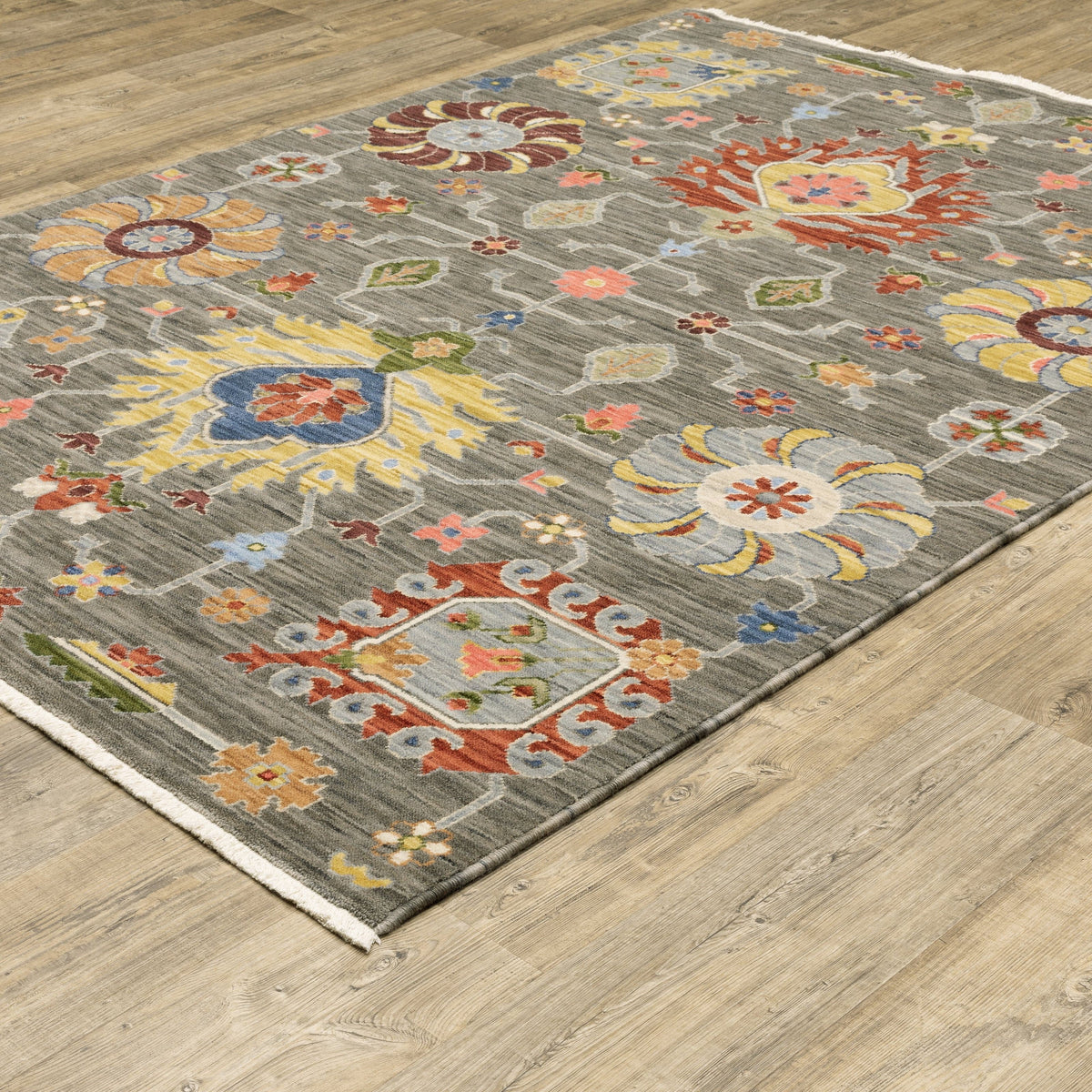 Lucca Charcoal & Multi Traditional Rug with vibrant floral patterns on a gray wool/nylon blend.