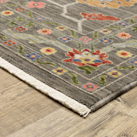 Lucca Grey & Multi Traditional Rug with floral patterns, space-dyed wool/nylon, and fringed edge.