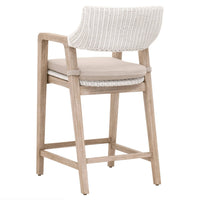 Lucille white rattan counter stool with a beige cushion and light mahogany wood frame.