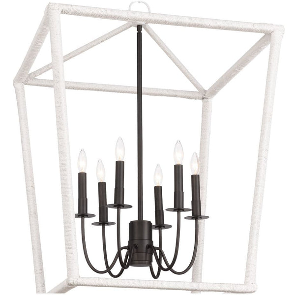 Large Luella lantern with textured white frame and elegant blackened brass candelabra lighting.