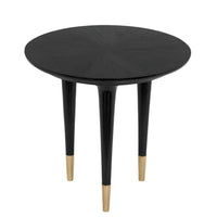 Round charcoal black sungkai wood side table with brass cap legs, modern design.