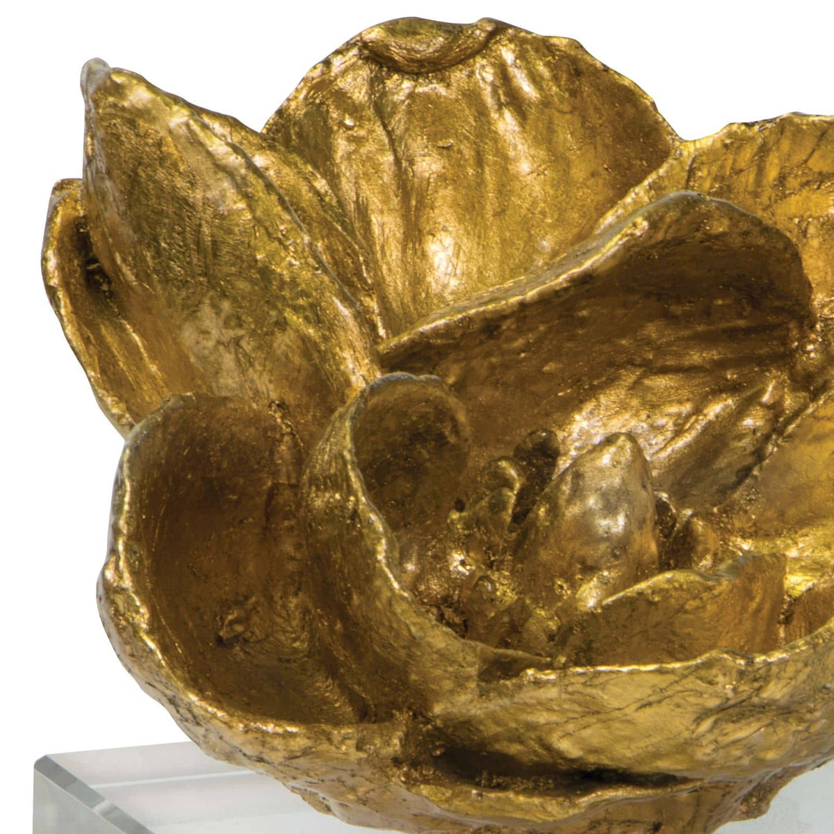 Gold leaf magnolia bloom objet on a clear crystal base, 5" tall, with a modern glam style.
