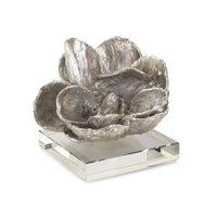 Silver leaf magnolia bloom sculpture on a clear crystal base, 5" tall.