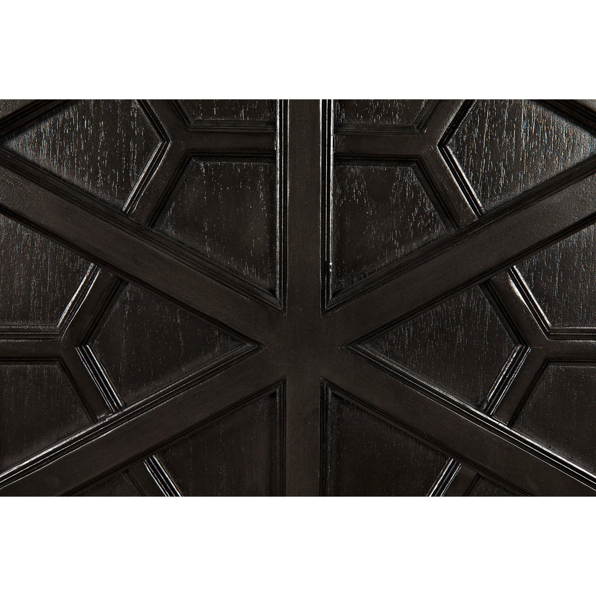Close-up of a dark burnished mahogany hutch door with intricate geometric hand-carving.