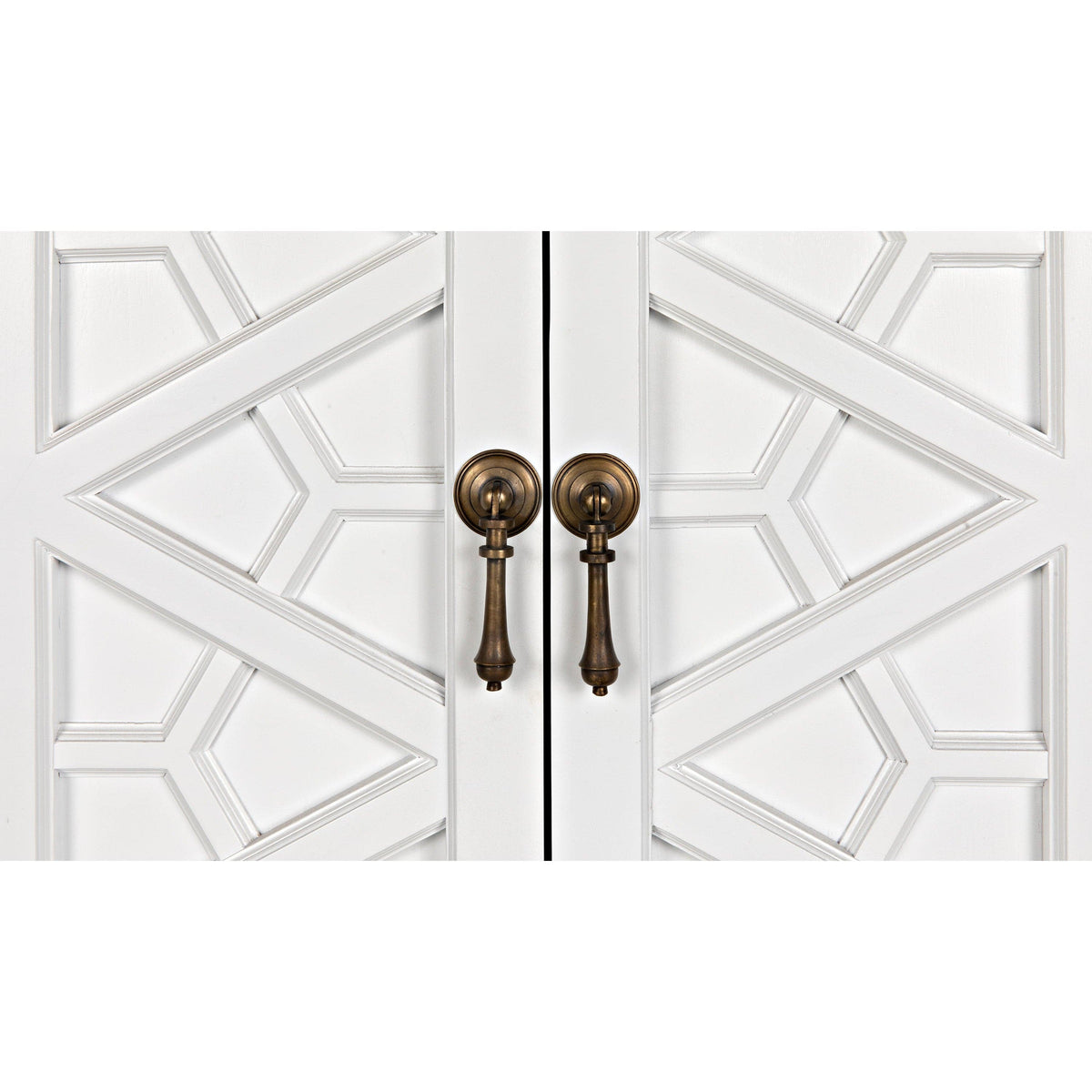 White mahogany hutch doors with intricate geometric hand-carving and antique brass drop pulls.