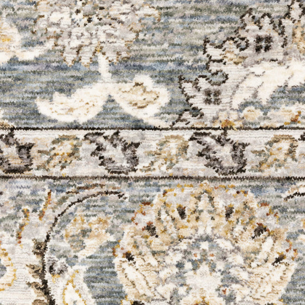 Close-up of a Maharaja Blue & Ivory Traditional Rug with intricate floral and scroll patterns.