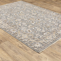 Maharaja Blue & Ivory Traditional Rug with intricate floral patterns on a gray polyester surface.