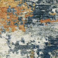 Close-up of Malibu Blue & Gold Washable Rug with abstract, distressed design and low-profile polyester weave.