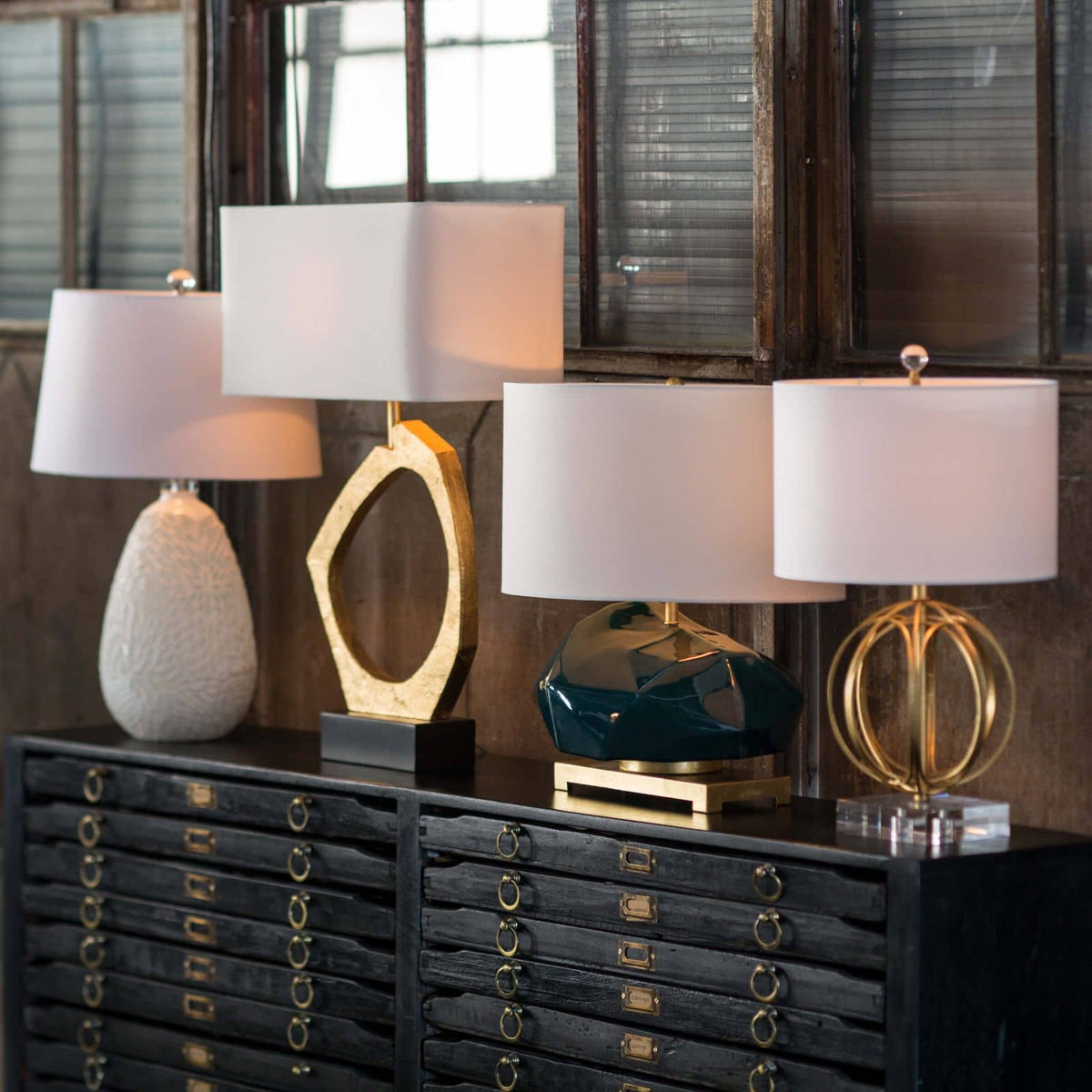 Manhattan Table Lamp Gold Leaf with organic gilded base and rectangular linen shade.