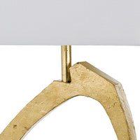 Manhattan Table Lamp with a sculptural gold leaf base and rectangular white linen shade.
