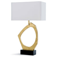 Manhattan Table Lamp with a sculptural gold leaf base, black rectangular plinth, and white linen shade.