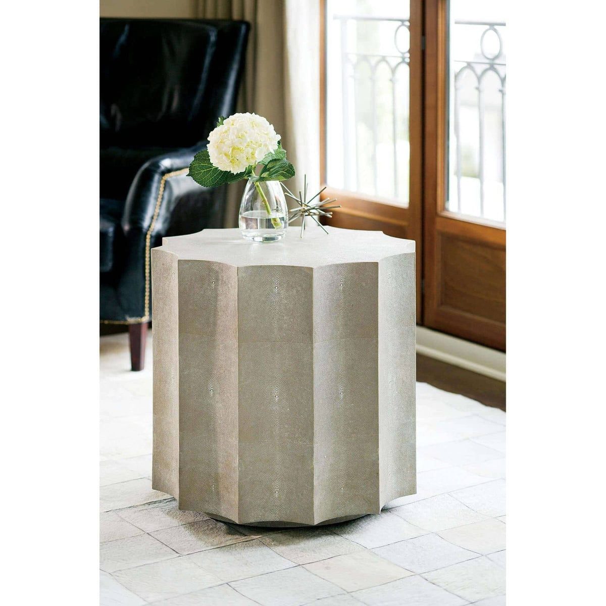 Marilyn Ivory Shagreen Scalloped Accent Table with faux shagreen covering, modern shape, and casters.