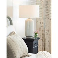 Markus 28.5" ceramic table lamp with a freckled body, polished nickel finish, and natural linen drum shade.