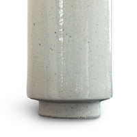 Close-up of Markus Ceramic Table Lamp base, showing neutral ceramic with freckled pattern and polished nickel finish.