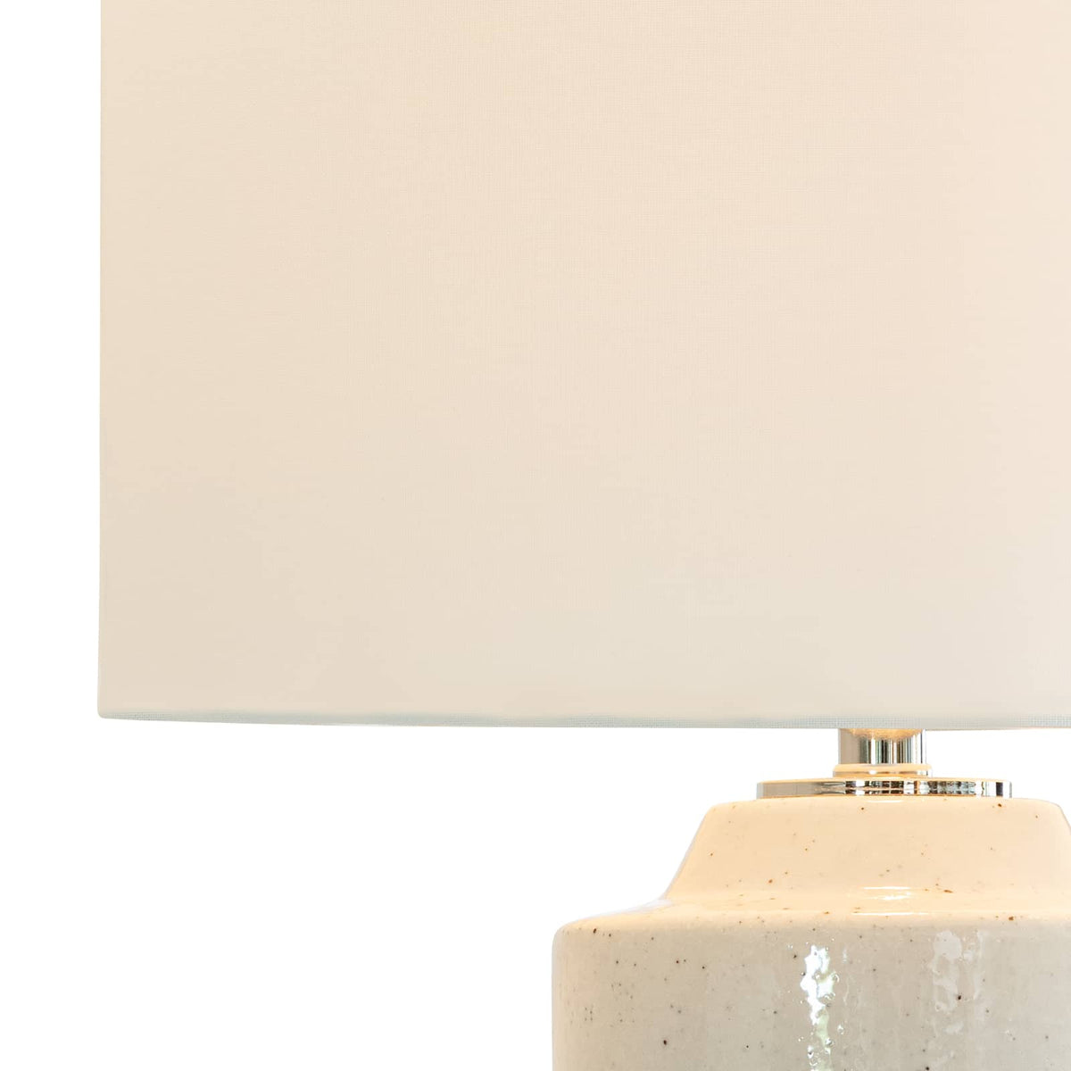 Markus Ceramic Table Lamp with a neutral freckled ceramic body and a crisp natural linen drum shade.