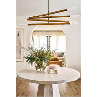 Round Marlow White Marble Plate displaying a candle on a light wood table.