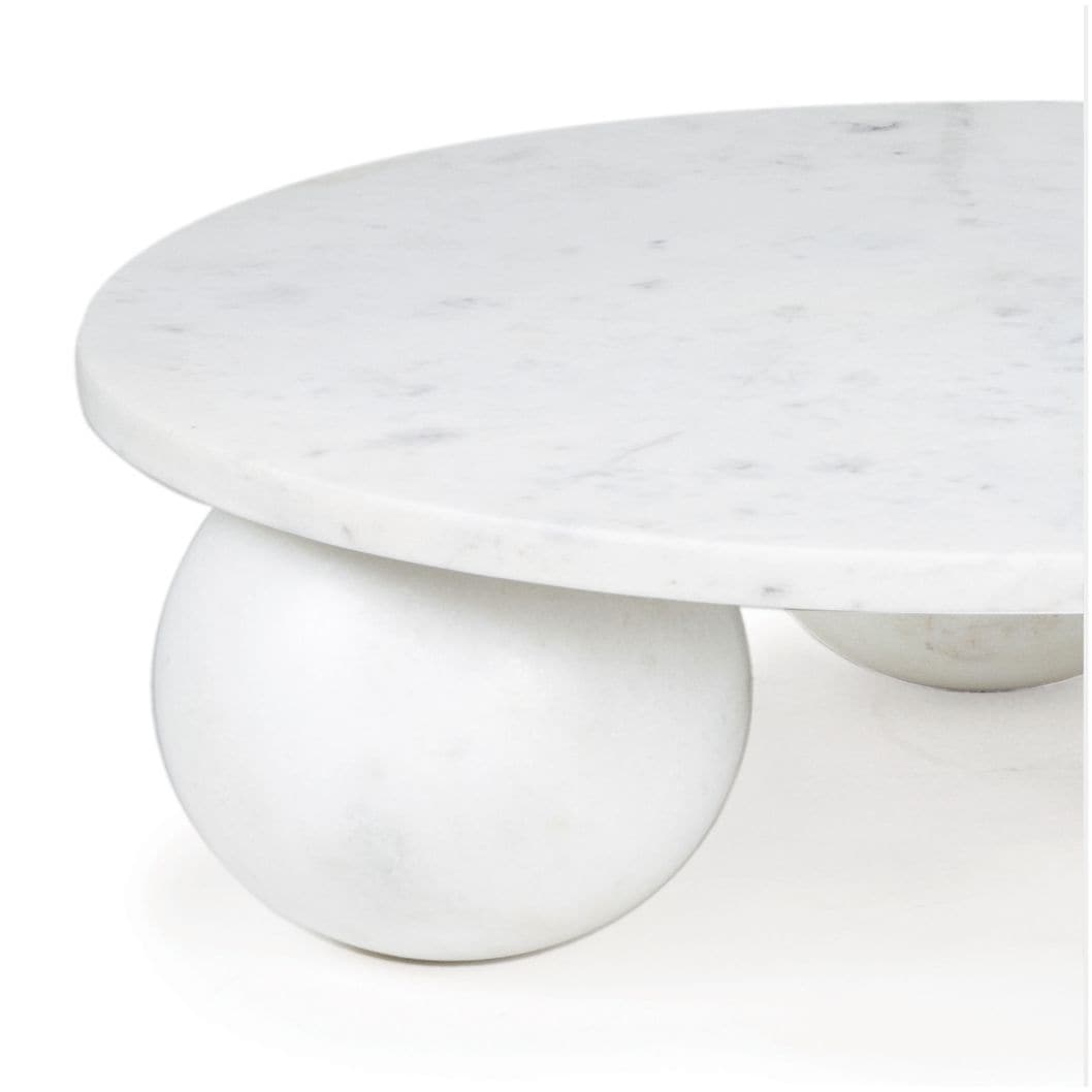 Round white marble plate with a smooth surface and two spherical feet.