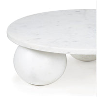Round white marble plate with a smooth surface and two spherical feet.