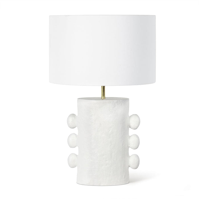 White Maya Metal Table Lamp with a textured, sculptural base and a clean linen drum shade.